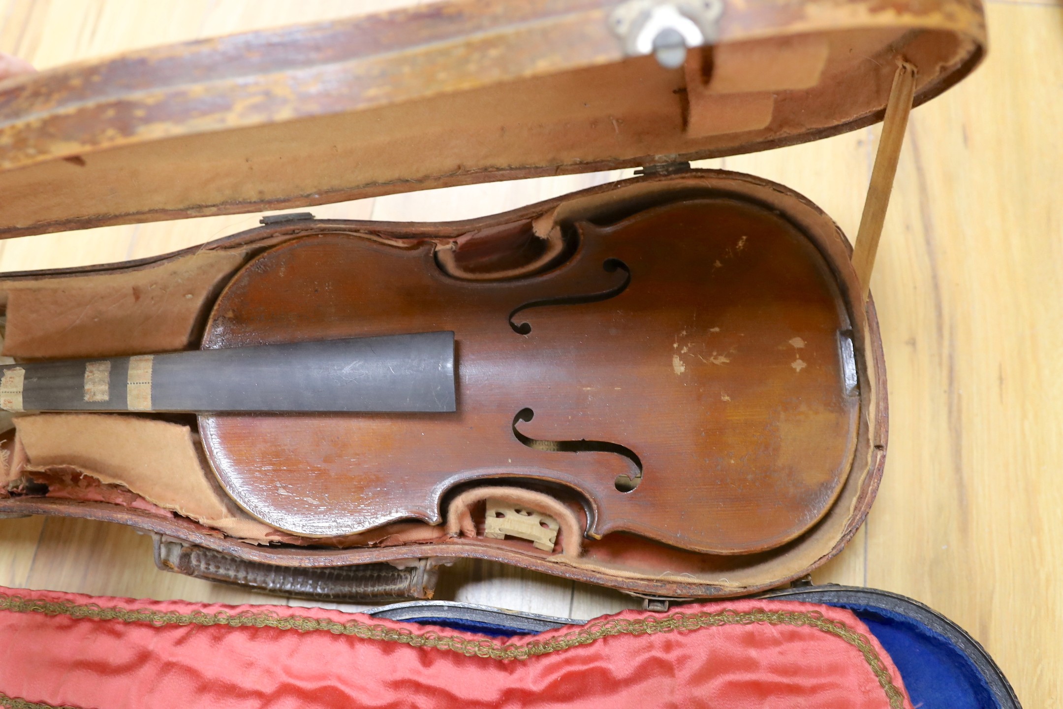 A French mid 20th century violin and one other and two bows